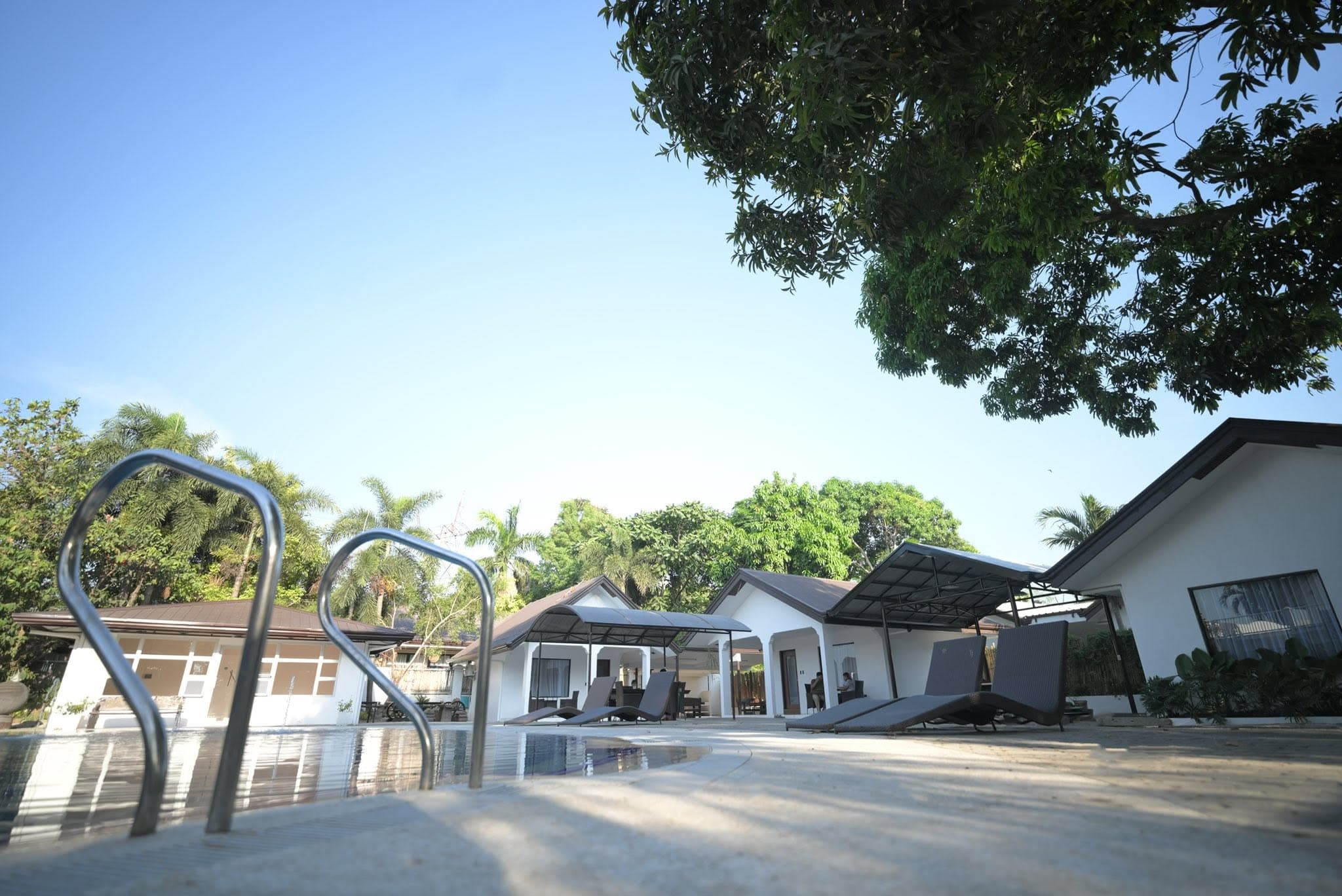 Pool pavilion with lounge chairs